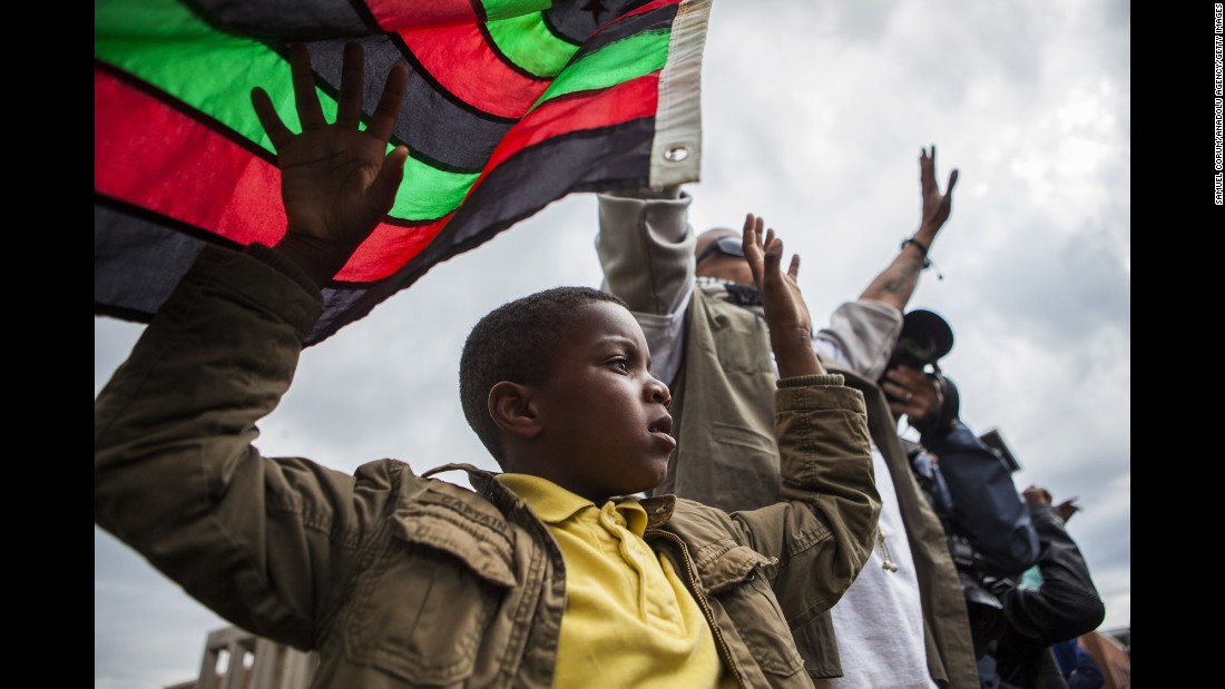 People march through the streets of Baltimore on April 22.