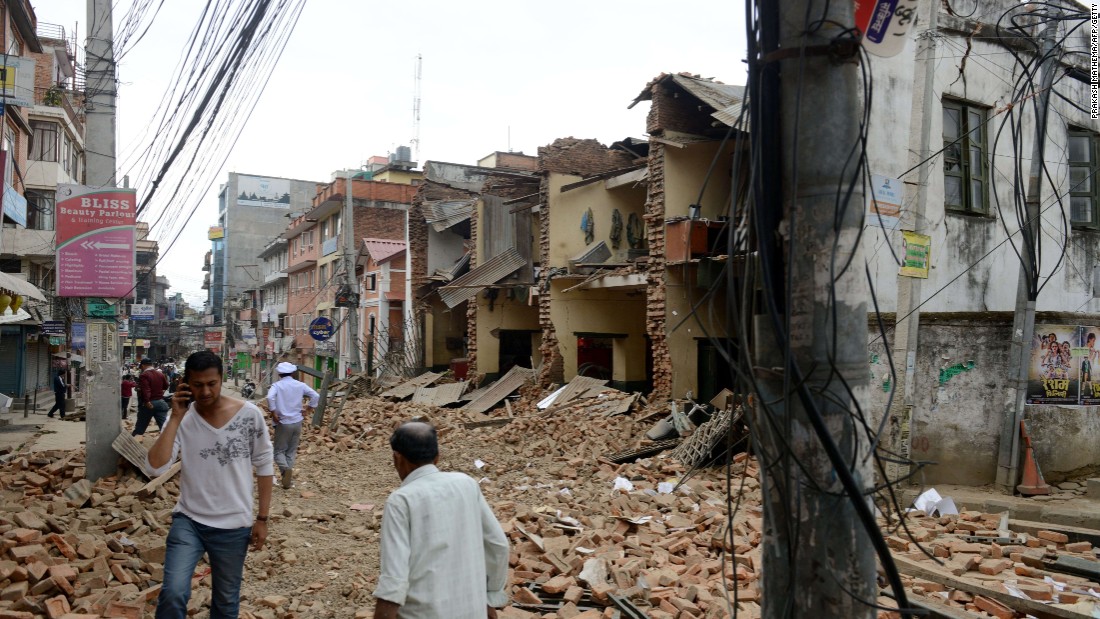 The rubble of collapsed walls fills a street in Lalitpur, on the outskirts of Kathmandu, on April 25.