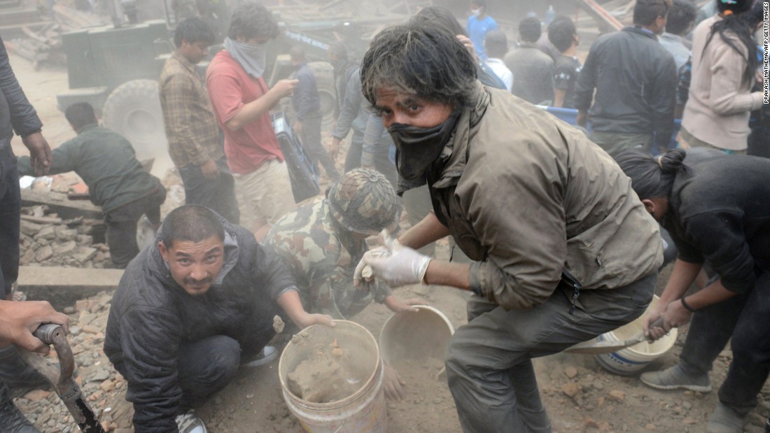 Rescuers clear rubble in Kathmandu&#39;s Basantapur Durbar Square on  April 25.