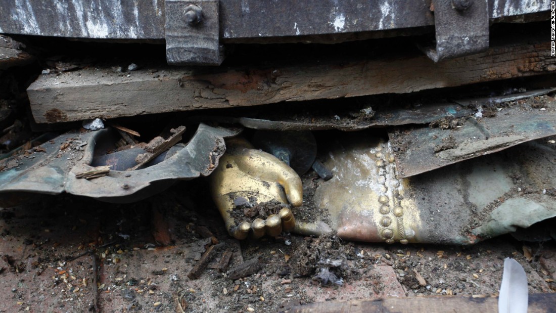 The hand of a statue is seen under debris in Basantapur Durbar Square in Kathmandu.