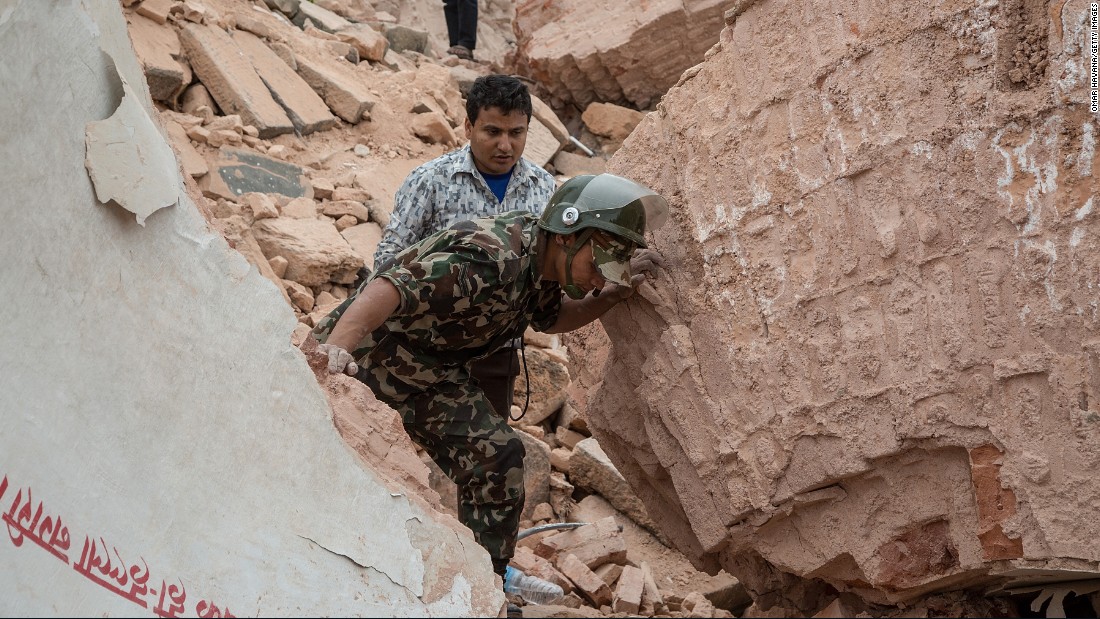 Emergency rescue workers search for survivors in the debris of Dharahara on April 25.