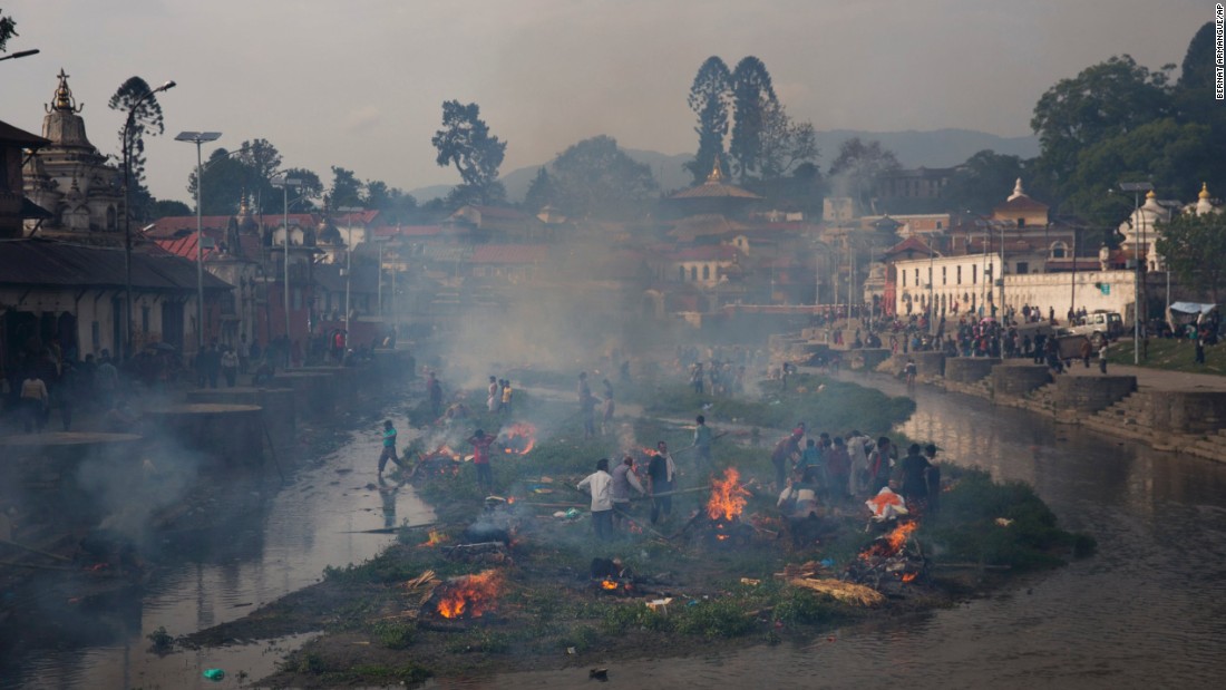 Smoke from funeral pyres fills the air at the Pashupatinath temple on the banks of Bagmati River in Kathmandu on April 26.