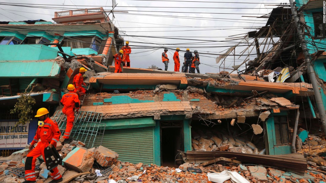 Members of India&#39;s National Disaster Response Force look for survivors in Kathmandu on April 26. 