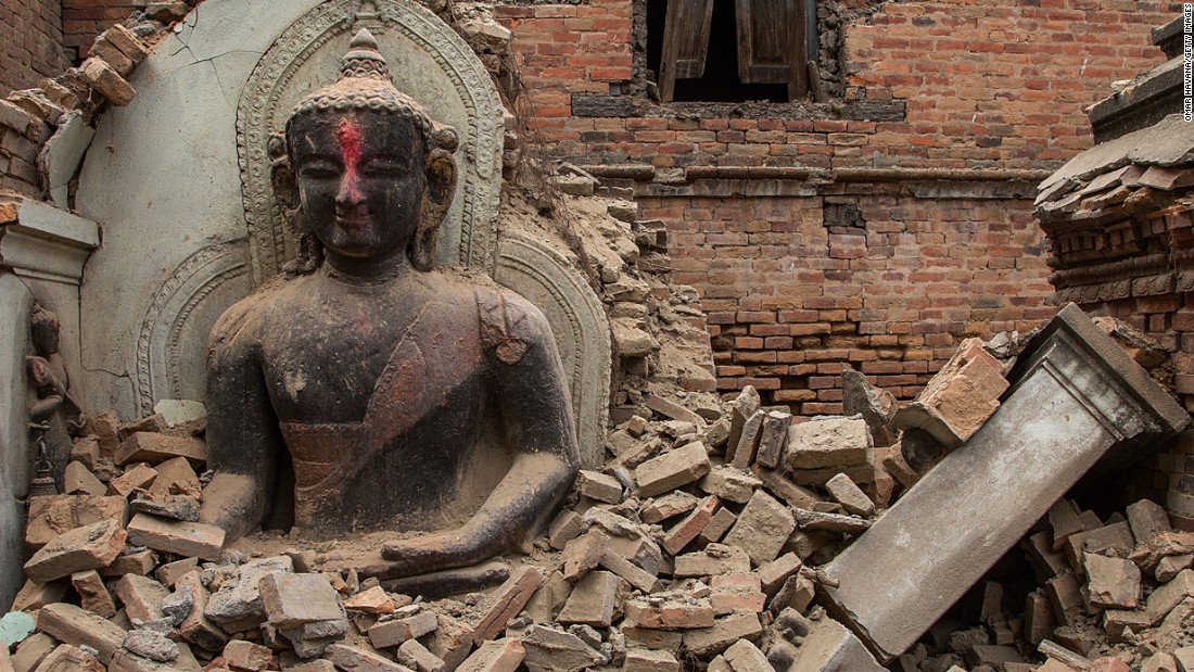 A Buddha statue is surrounded by debris on April 26 from a collapsed temple in the UNESCO world heritage site of Bhaktapur.