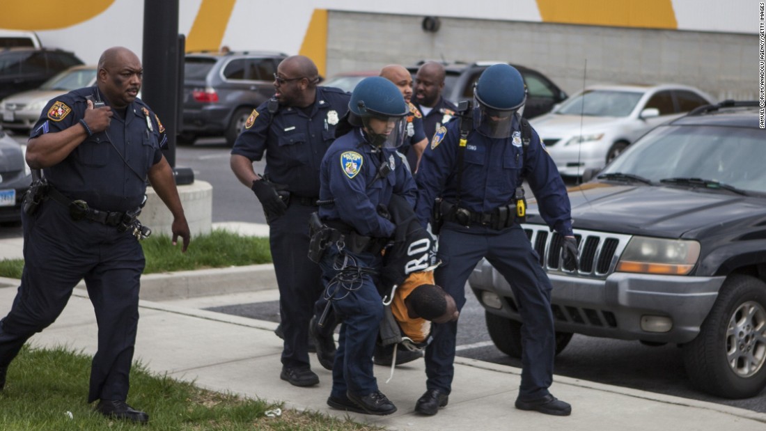 Police handle the protesters during a riot on April 27.