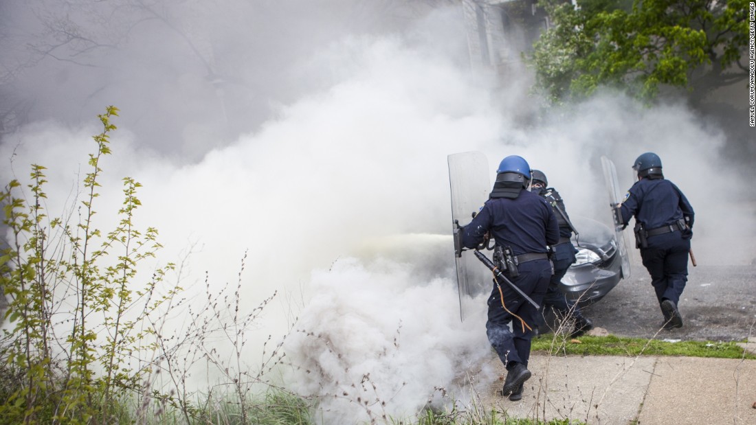 Police react during the riot on April 27.