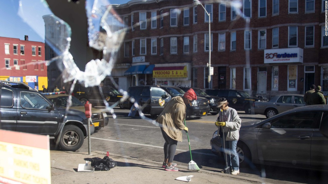 Two women sweep up the streets in Baltimore -- reflected in the broken window of a storefront on April 28. &lt;a href=&quot;http://www.cnn.com/2015/04/29/us/gallery/baltimore-protests-cleanup/index.html&quot;&gt;See more photos of the cleanup efforts.&lt;/a&gt;