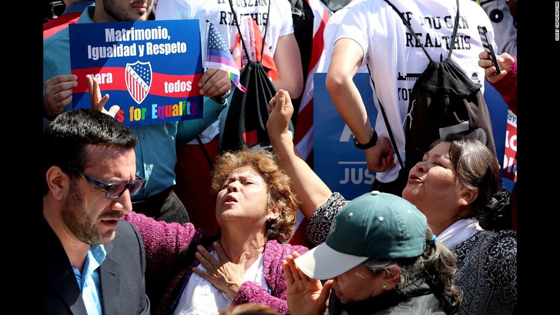 A group against same-sex marriage prays in an &quot;appeal to heaven&quot; outside the Supreme Court.