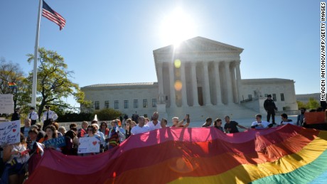 Supporters of same-sex marriages gather outside the U.S. Supreme Court waiting for its decision on April 28, 2014 in Washington, D.C.