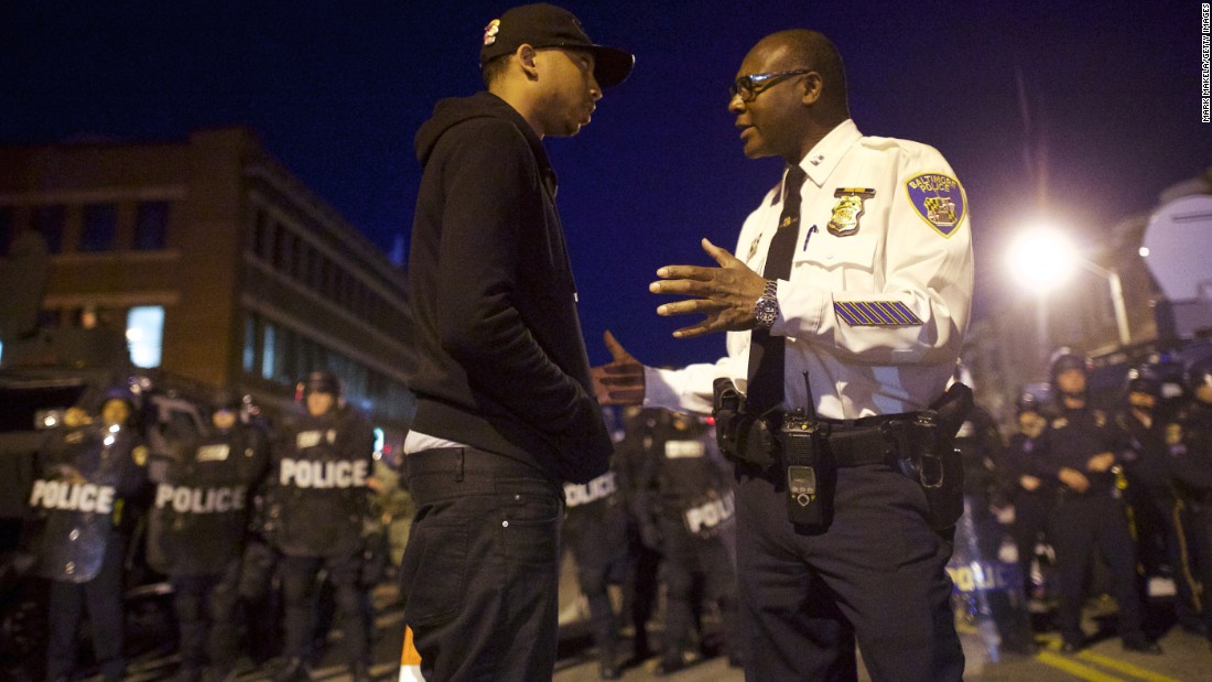 A Baltimore police captain tries to calm a protester on April 28.