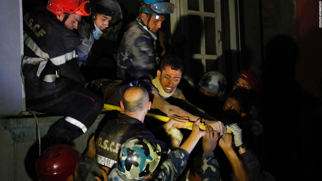 A man is freed from the ruins of a hotel by French rescuers in the Gangabu area of Kathmandu on Tuesday, April 28. Reuters identified the man as Rishi Khanal.