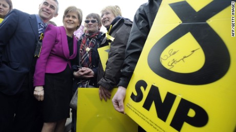 First Minister of Scotland and leader of the SNP Nicola Sturgeon (2L) poses with supporters during a UK general election campaign visit to the Cook School in Kilmarnock, Ayrshire, southwest Scotland on April 27, 2015. Britain goes to the polls on May 7 to elect a new parliamnt. SNP leader Nicola Sturgeon, whose party is expected to win most of Scotland&#39;s House of Commons seats amid surging support after last year&#39;s rejected independence referendum, wants to do a post-election deal with Labour. AFP PHOTO / ANDY BUCHANANAndy Buchanan/AFP/Getty Images