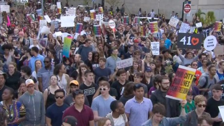 Thousands gather in the streets of Baltimore in a peaceful march and protest.