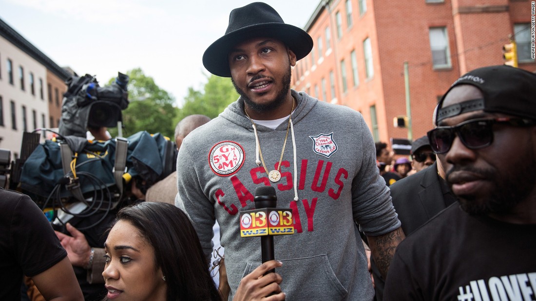 NBA star Carmelo Anthony of the New York Knicks marches with protesters from Baltimore&#39;s Sandtown neighborhood to City Hall on April 30.