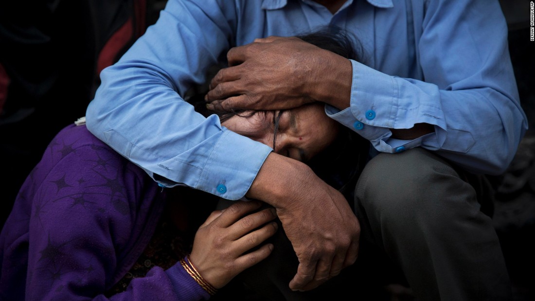 A woman receives comfort during the funeral of her mother, a victim of Nepal&#39;s deadly earthquake, on Friday, May 1, in Kathmandu. 