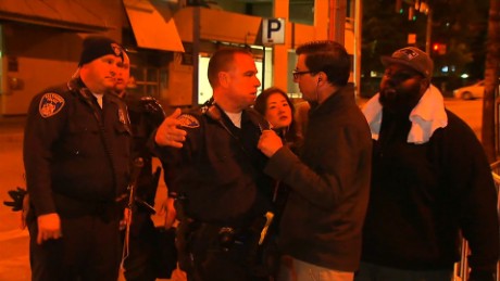 A Baltimore police officer confronts CNN&#39;s Miguel Marquez over where the media can stand during curfew.