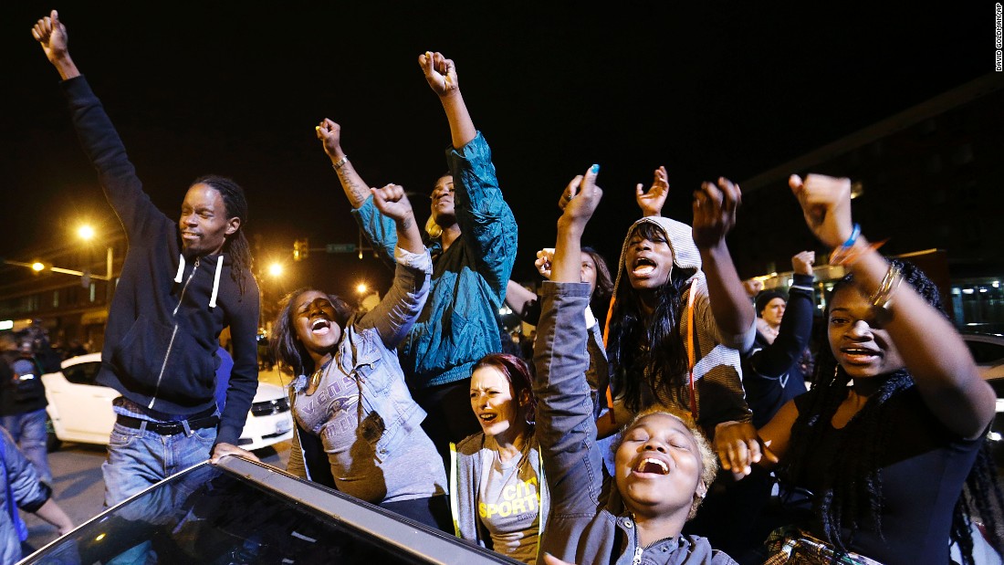 Demonstrators celebrate the announcement that six officers were charged May 1 in Gray&#39;s death. 