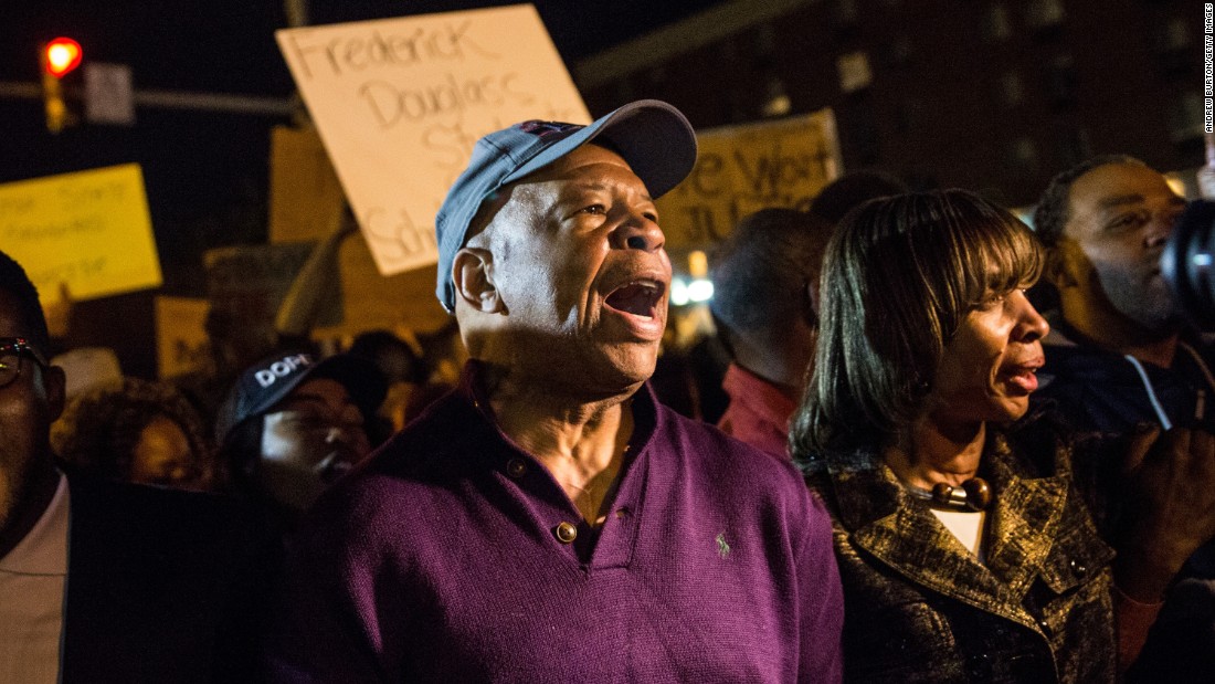 U.S. Rep. Elijah Cummings, D-Maryland, helps clear Baltimore streets of protesters on May 1. 