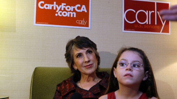 Fiorina, left, watches election results with granddaughter Kara Tribby, 7, in her hotel room at the Hyatt Regency Irvine, November 2, 2010, in Irvine, California. 