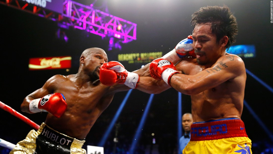 Floyd Mayweather connects with a strong left on Manny Pacquiao at the welterweight world championship unification fight.