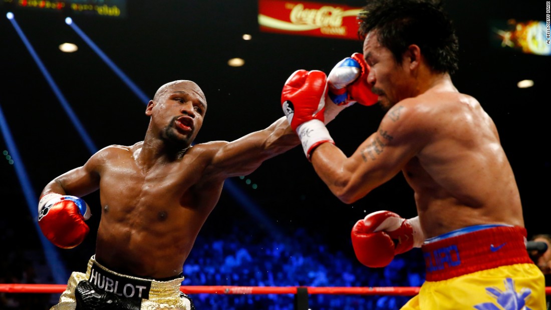 Floyd Mayweather throws a nasty left at Manny Pacquiao. 