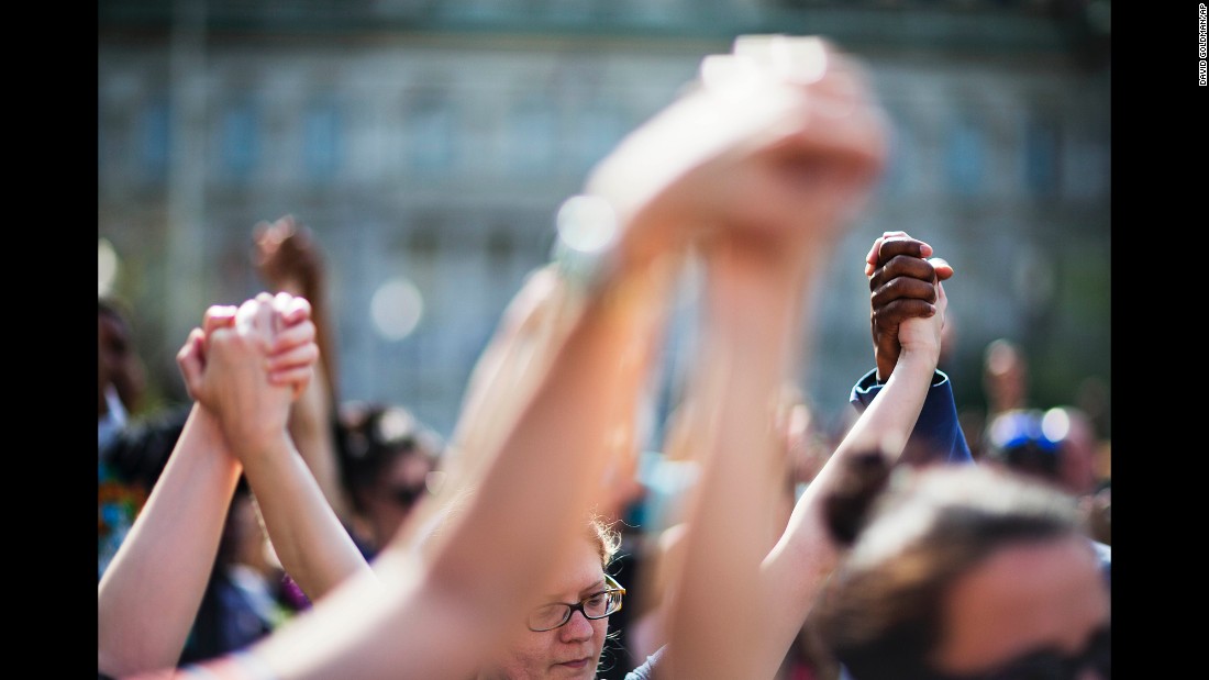 People hold hands during a rally at Baltimore City Hall on Sunday, May 3. The death of Freddie Gray, who died in police custody, sparked rioting in Baltimore and protests &lt;a href=&quot;http://www.cnn.com/2015/04/30/us/gallery/freddie-gray-protests-across-us/index.html&quot; target=&quot;_blank&quot;&gt;across the country&lt;/a&gt;. 