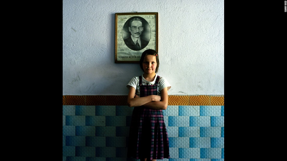 A student in an elementary school stands in front of a photo of Ataturk in Kutahya, central Turkey.