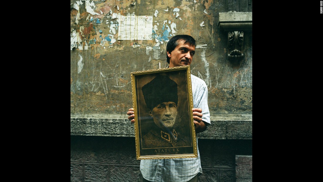An antiques dealer on a back street in Istanbul&#39;s fashionable Beyoglu district holds an image of Ataturk for sale. &quot;This is where I bought the framed Ataturk portrait that hangs in my home in London,&quot; said Emin.&lt;br /&gt;