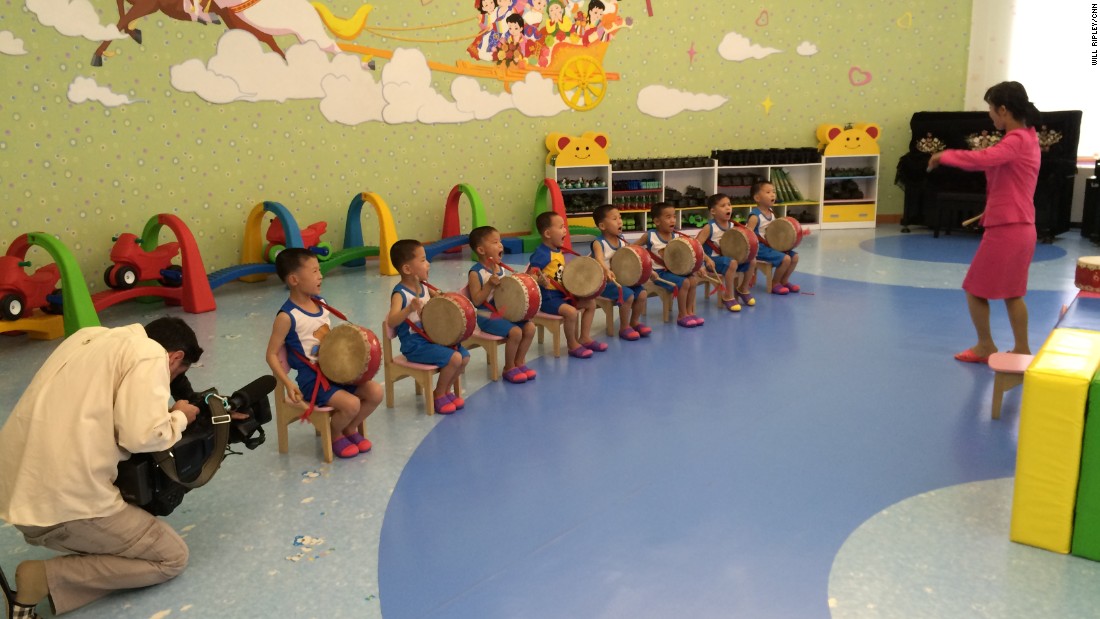 Young boys practice a drum routine that they will perform during International Children&#39;s Day.