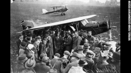 Amelia Earhart is surrounded by a crowd of well-wishers and reporters on arrival at Hanworth Air Park in England after crossing the Atlantic in 1932. 