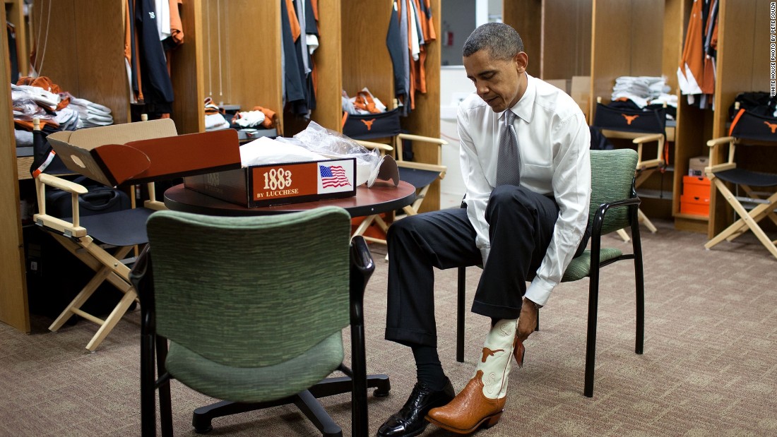Trying on a pair of cowboy boots at the University of Texas in Austin on August 9, 2010. 