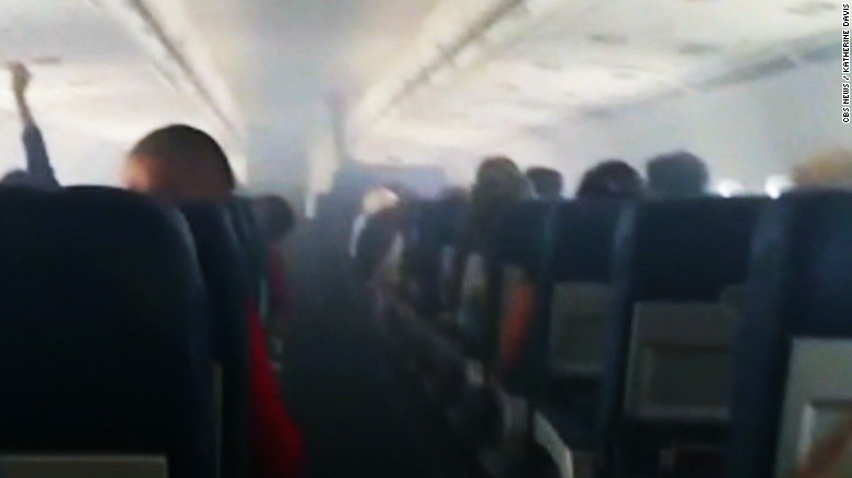 Smoke fills passenger plane - CNN Video