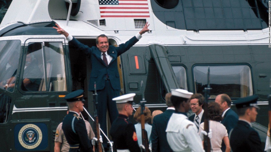 U.S. President Richard Nixon gestures in the doorway of a helicopter on August 9, 1974, after leaving the White House following his resignation over the Watergate scandal. Nixon&#39;s resignation marked the end to one of the biggest political scandals in U.S. history, which began in 1972 after a break-in at the Democratic National Committee&#39;s headquarters at the Watergate complex. Five men were arrested for the burglary, and the FBI and Washington Post reporters Bob Woodward and Carl Bernstein were able to trace them back to Nixon and the White House.