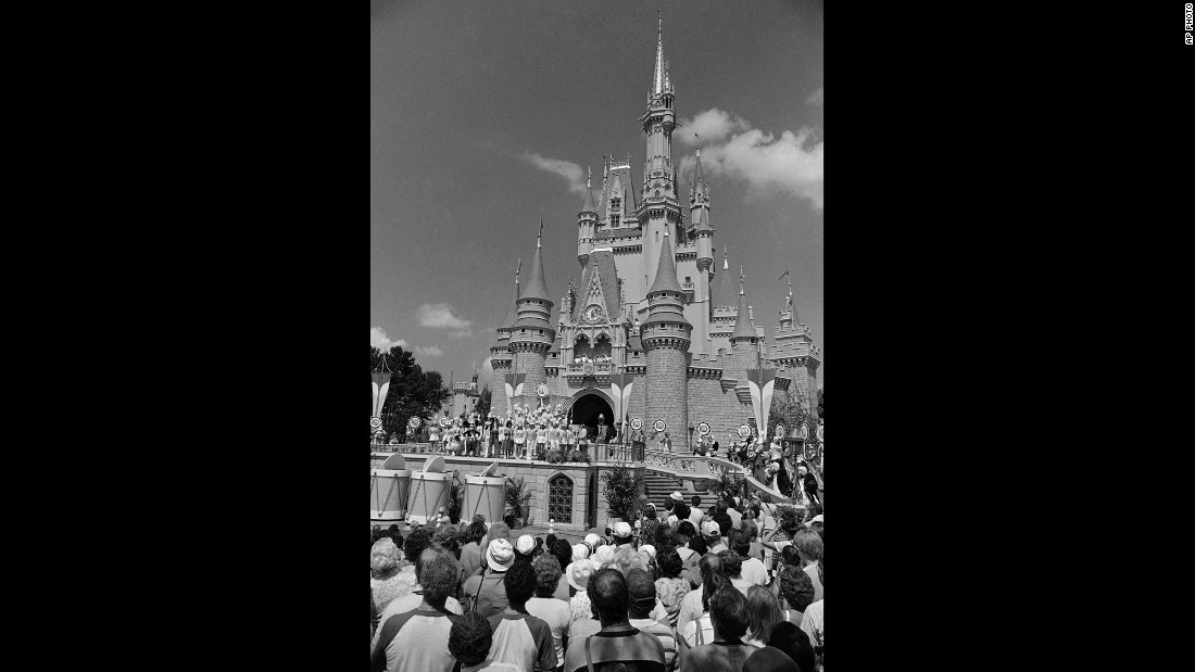 A crowd in Orlando waits for Walt Disney World&#39;s Main Street to open in October 1971. The park cost an estimated $400 million to build and now attracts around 25 million visitors annually. When Disney World opened in 1971, the price for admission was $3.50. A single-day ticket now is $105 for anyone over 10 years old.