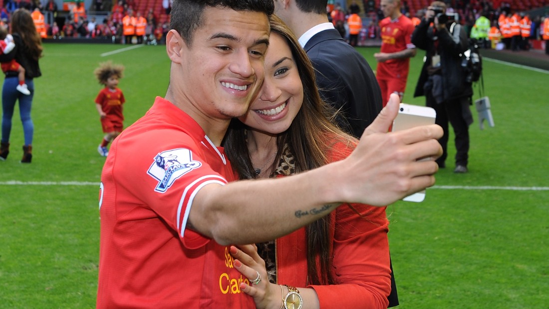A selfie taken with wife Aine at Anfield during the 2013-14 end of season lap of honor. The pair are childhood sweethearts and she left everything in Brazil behind to support him when he moved to Europe.