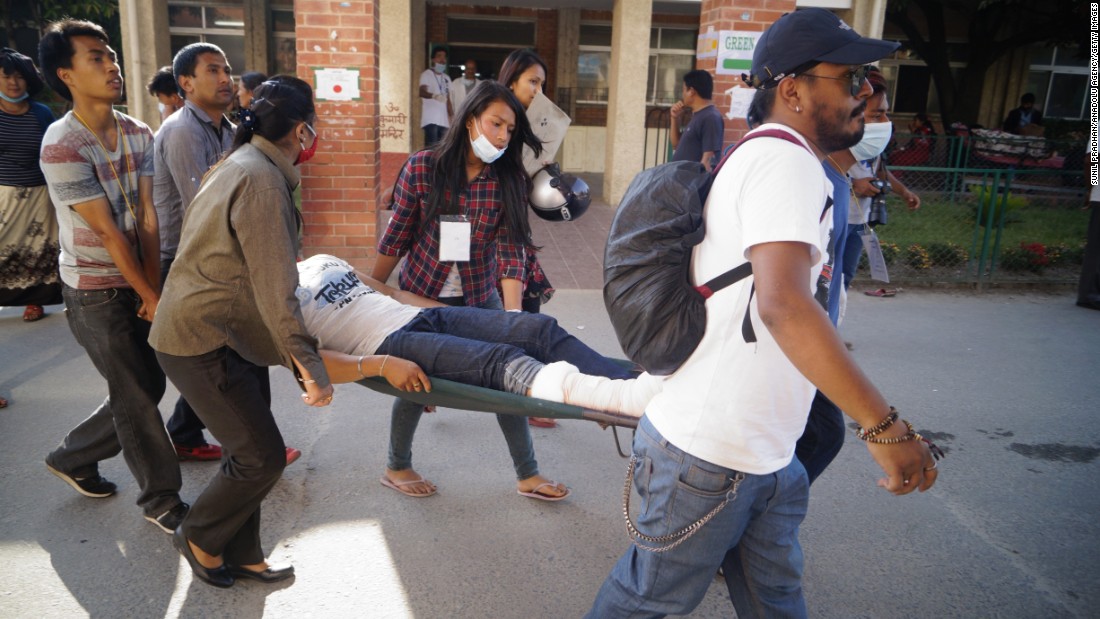 An injured person is carried in Kathmandu on May 12.