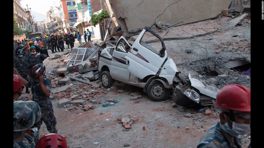 A car is smashed under the weight of a collapsed building in Kathmandu on May 12.
