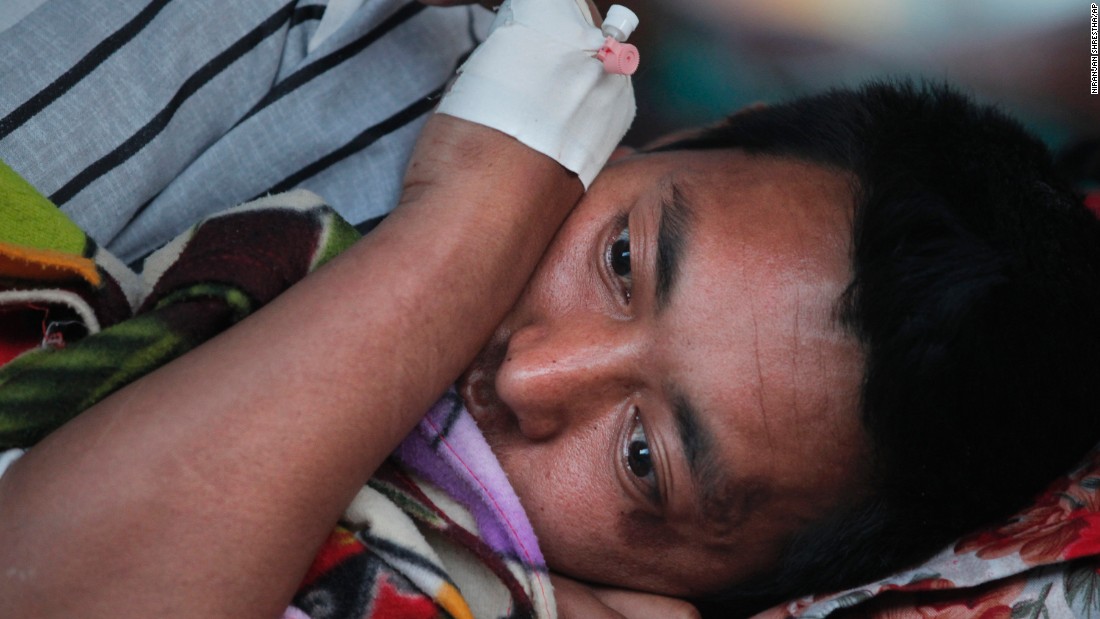 An injured man rests at a hospital in Kathmandu on May 12.