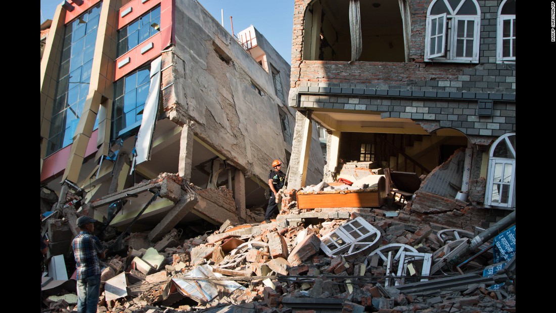 People look through the debris of buildings in Kathmandu on May 12.