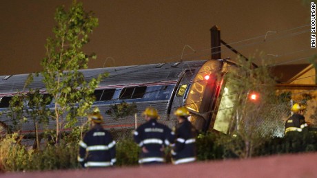Emergency personnel work the scene of a train wreck, Tuesday, May 12, 2015, in Philadelphia. An Amtrak train headed to New York City derailed and crashed in Philadelphia.