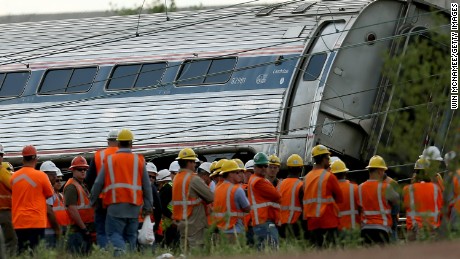 PHILADELPHIA, PA - MAY 13:  Investigators and first responders work near the wreckage of an Amtrak passenger train carrying more than 200 passengers from Washington, DC to New York that derailed late last night May 13, 2015 in north Philadelphia, Pennsylvania. At least five people were killed and more than 50 others were injured in the crash.  (Photo by Win McNamee/Getty Images)