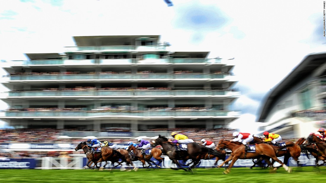 The grandstand is a mere blur as the race action hots up on the turf.