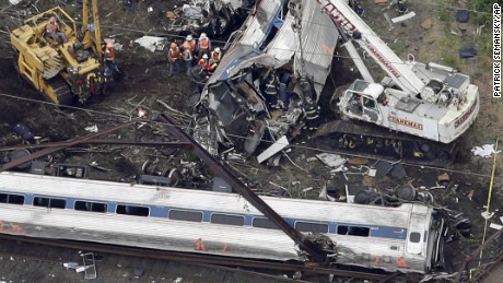 Emergency personnel work at the scene of a deadly train wreck, Wednesday, May 13, 2015, in Philadelphia. More than 200 people aboard the Washington-to-New York train were injured in the derailment that plunged screaming passengers into darkness and chaos Tuesday night. (AP Photo/Patrick Semansky)
