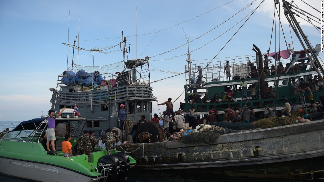 Fishermen and National Park officials provide food supplies to Rohingya migrants stranded on the boat. An Indonesian spokesman said on Wednesday, May 13, that provisions had been given to a migrant boat in the Strait of Malacca before the boat carried on its way to Malaysia -- purportedly the boat&#39;s intended destination.