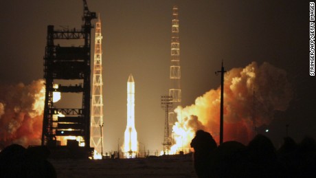 Caption:Russian-built Proton-M rocket with the Turksat-4A Turkish communications satellite blasts off at the Russian leased Kazakhstan&#39;s Baikonur cosmodrome on February 15, 2014. AFP PHOTO/STRINGER (Photo credit should read STRINGER/AFP/Getty Images)
