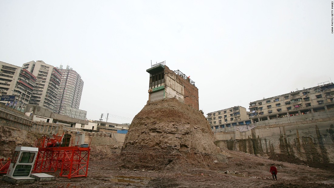 One of the most famous &quot;nail houses&quot; was a building in Chongqing, western China. The homeowner hung a banner and the national flag in protest and refused to sell to a developer who went ahead with construction around the site in 2007.