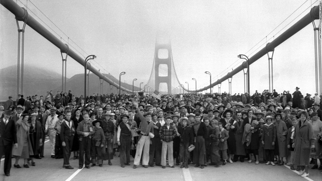 The Golden Gate Bridge, which spans the San Francisco Bay and connects the city to its northern suburbs, is one of the world&#39;s most famous structures. Its construction 78 years ago over a deep, treacherous channel was a marvel of modern engineering. In this photo, pedestrians walk across the bridge on May 27, 1937 -- one day before it opened to vehicular traffic. Click through to see other photos of the bridge&#39;s construction and grand opening.