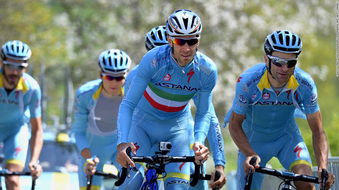 The Italian (center) is free to defend his title in July after Astana was allowed to keep its racing license despite a series of doping scandals, the International Cycling Union (UCI) announced on April 23, 2015.