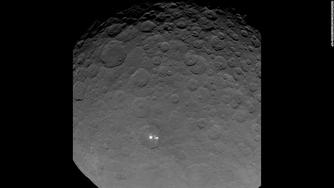 Dawn gave scientists a big surprise: Ceres has a group of bright spots glowing inside a large crater. The above image is part of a sequence taken by Dawn on May 16, 2015 when the spacecraft was 4,500 miles (7,200 kilometers) away from Ceres. It&#39;s the closest view yet of the spots. But what are they? According to the mission&#39;s principal investigator, Christopher Russell, scientists have concluded the spots are &quot;due to the reflection of sunlight by highly reflective material on the surface, possibly ice.&quot;