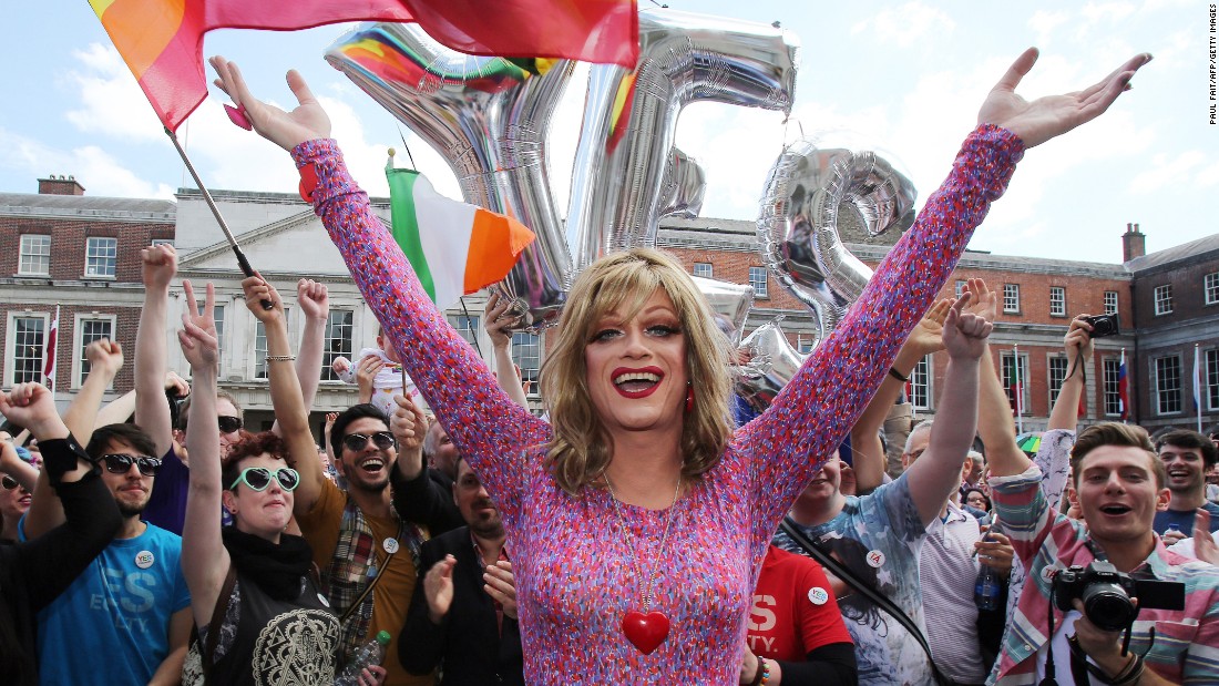 Drag queen and gay rights activist Rory O&#39;Neill, also known by the stage name Panti, raises her arms with supporters for same-sex marriage at Dublin Castle on Saturday, May 23. 